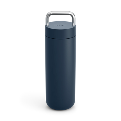 Fellow Carter Carry Travel Mug: tall, dark blue with a silver handle on a white background.