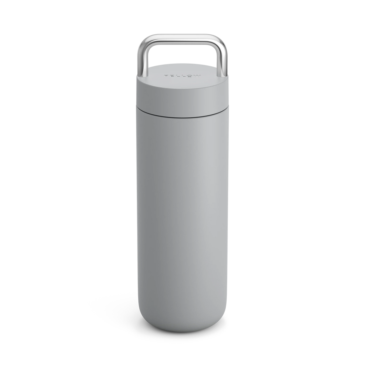 The Fellow Carter Carry Travel Mug is a sleek gray insulated mug with a silver top handle.