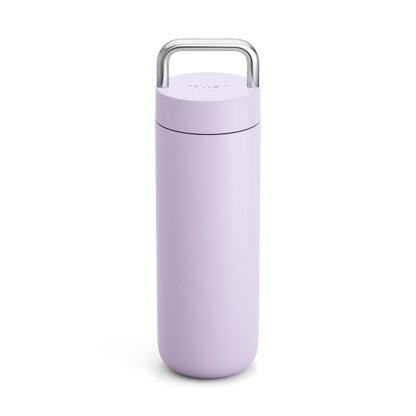 The Fellow Carter Carry Travel Mug in lavender with a silver handle, upright on white.