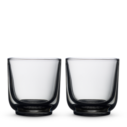 Two Fellow Pirch Espresso Glasses in Smoke shown side by side on a white background.