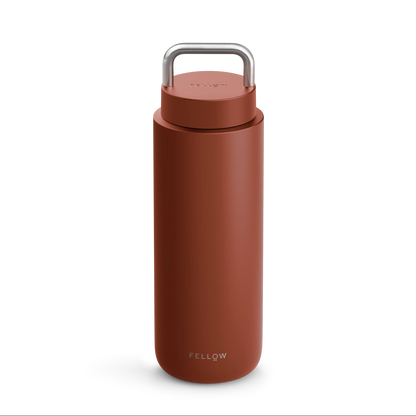 Matte brown Fellow Carter Carry Travel Mug with a metal handle on the lid.