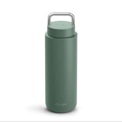 Matte green Fellow Carter Carry Travel Mug with silver handle and logo at the bottom.