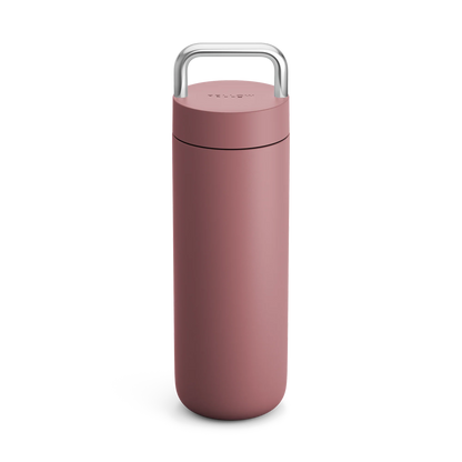 Fellow Carter Carry Travel Mug, matte pink with silver handle, shown on a white background.