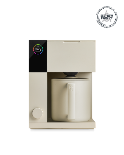 Fellow Aiden Precision Coffee Maker in Sesame with digital display and matching carafe.