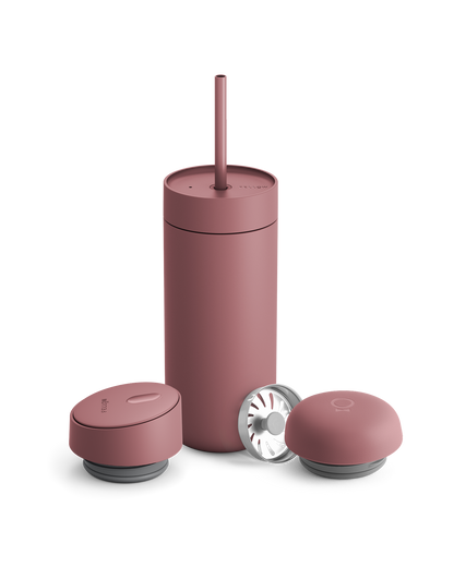 Fellow Carter 3-in-1 Lid System matte pink mug with straw and two containers on white background.
