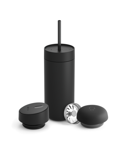 Fellow Carter 3-in-1 Lid System mug in matte black with straw, lid, and two round accessories.