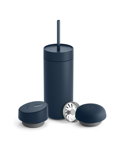 Dark blue Fellow Carter 3-in-1 Lid System mug with straw and accessories on white background.