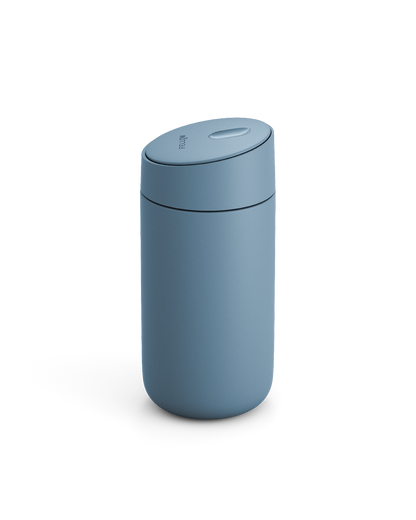 Fellow Carter Slide Mug in matte blue with rounded shape and matching lid, on white background.