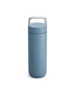Fellow Carter Carry Travel Mug in Hazy Blue with a metal handle on a white background.