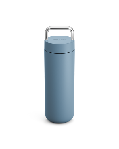 Fellow Carter Carry Travel Mug in Hazy Blue with a metal handle on a white background.