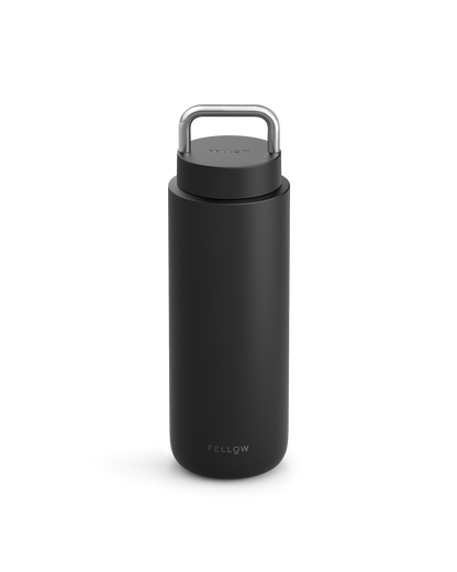 The Fellow Carter Carry Travel Mug is matte black with a silver handle and logo at the bottom.