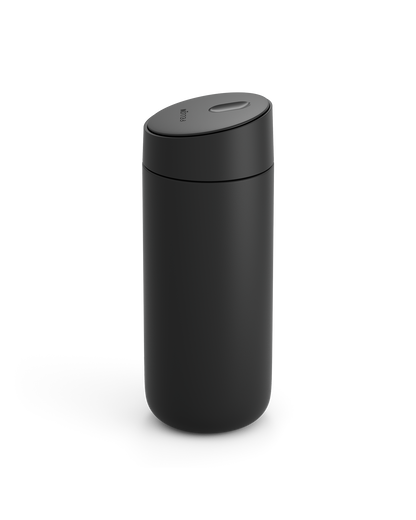 Fellow Carter Slide Mug in matte black with rounded body and matching lid on white background.