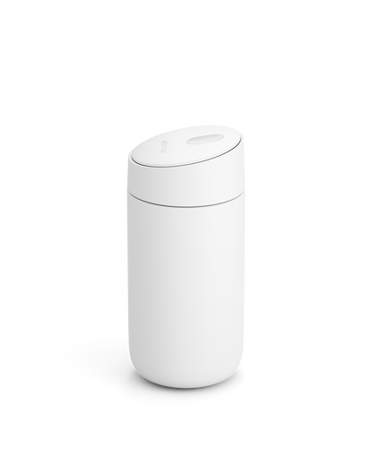 The Fellow Carter Slide Mug is a minimalist white cylinder with a rounded, slightly tilted lid.