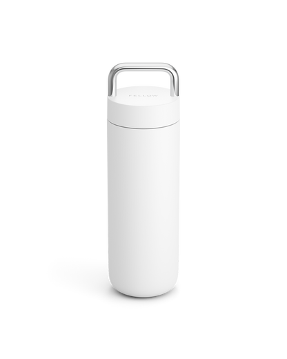 The Fellow Carter Carry Travel Mug in Matte White stands upright on a white background.