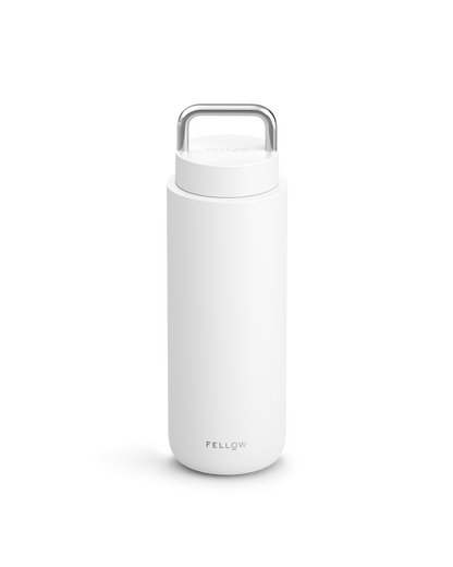 Matte White Carter Carry Travel Mug by Fellow with handle on lid and logo at bottom.
