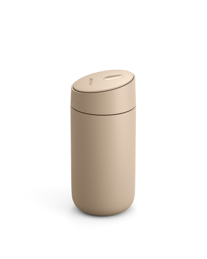 Fellow Carter Slide Mug, beige, with rounded lid on a white background.