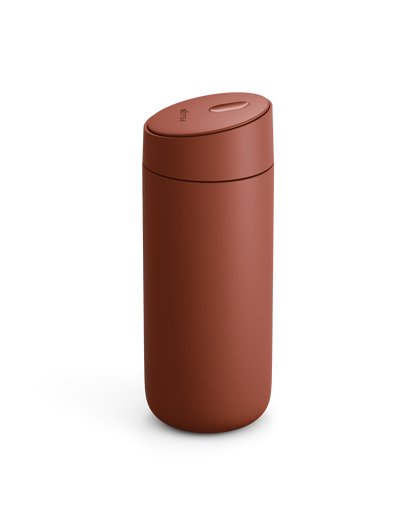 The Fellow Carter Slide Mug is a matte brown travel mug with a seamless, rounded design and lid.