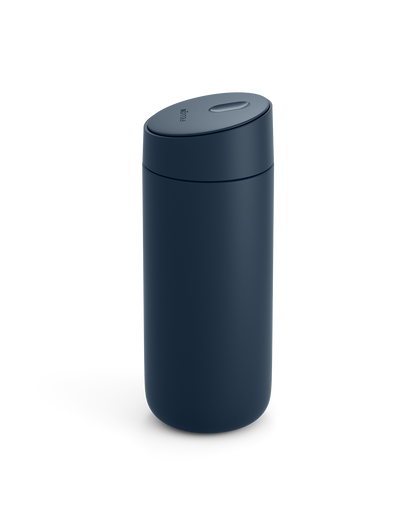 The Fellow Carter Slide Mug is dark blue with a matte finish and a rounded, spill-proof lid.