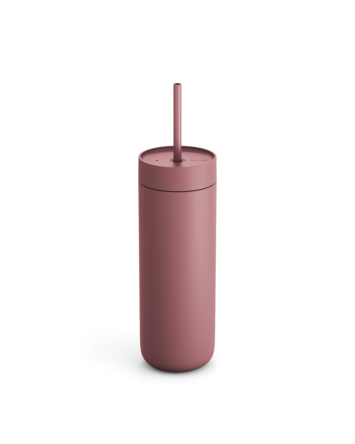 Fellow Carter Cold Tumbler in matte pink with lid and straw on a white background.