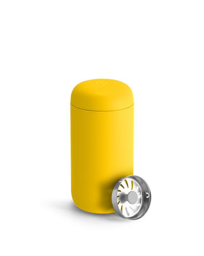 Fellow Carter Move Mug in Lemon Zest with metal tea infuser lid on a plain white background.