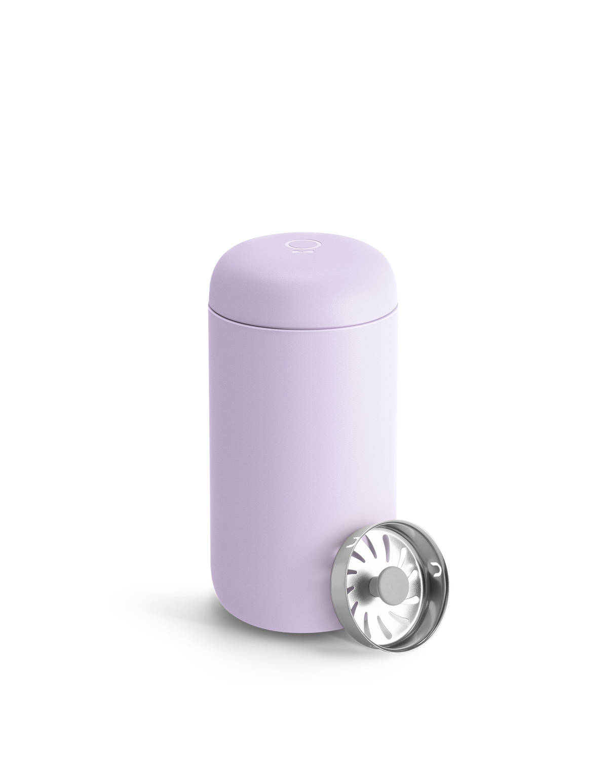 A light purple Fellow Carter Move Mug with a metal strainer leaning against it.
