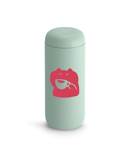 Light green Fellow Carter Move Mug with a pink frog holding a teacup on the front.