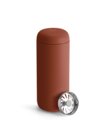 Fellow Carter Move Mug in matte reddish-brown with included metal infuser beside it.
