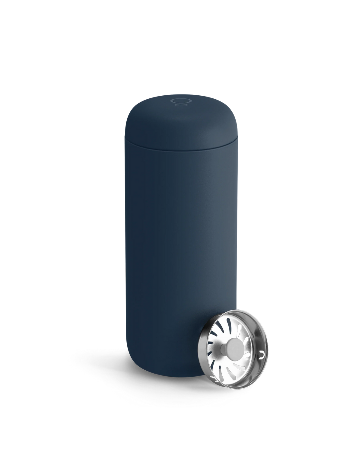 A Fellow Carter Move Mug in navy blue with its lid off and set next to it.