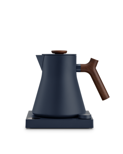 The Fellow Corvo EKG Electric Kettle is a fast, stylish matte navy kettle with wooden handle.