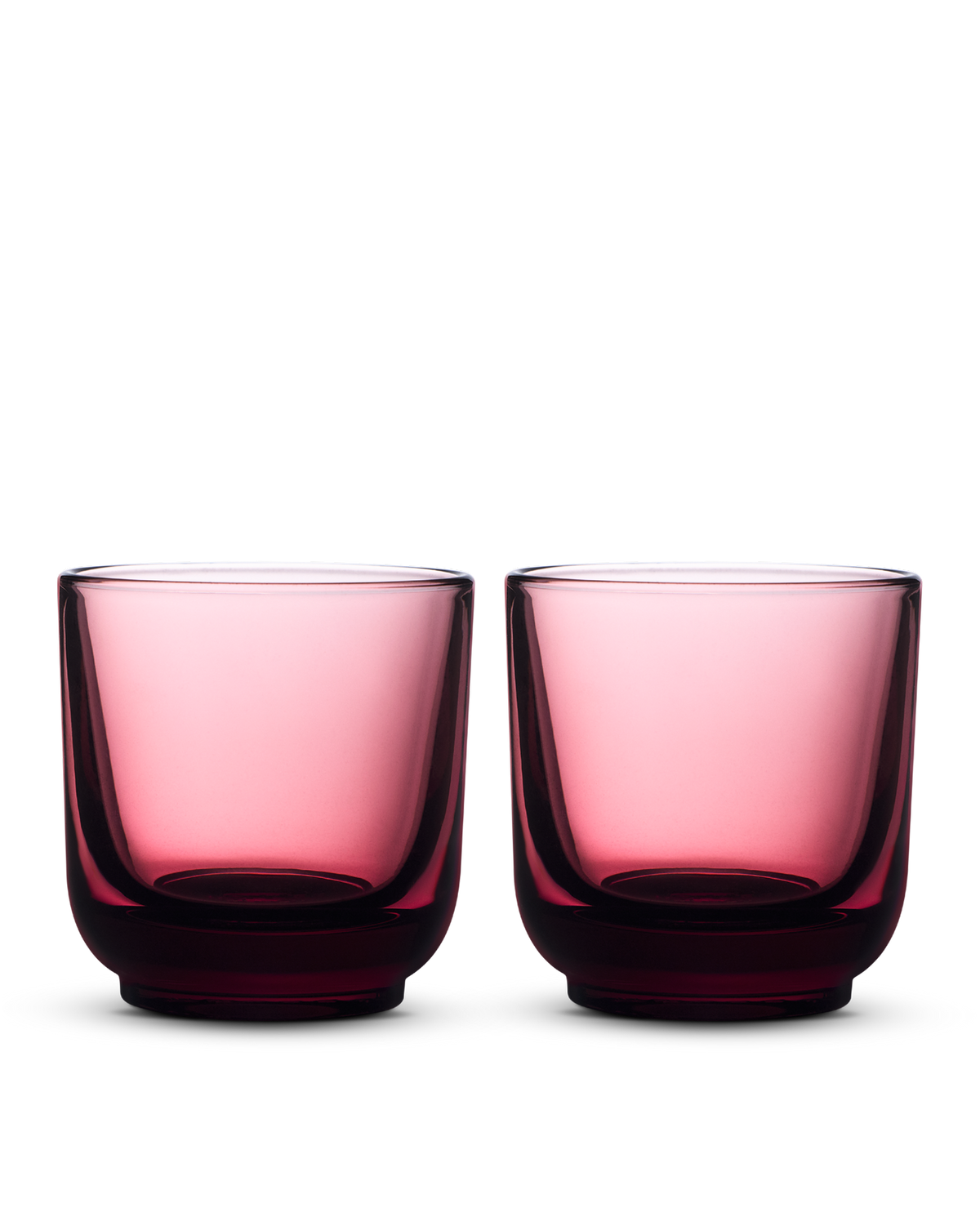 Two rounded, transparent Pirch Espresso Glasses by Fellow on a white background.