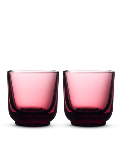 Two rounded, transparent Pirch Espresso Glasses by Fellow on a white background.