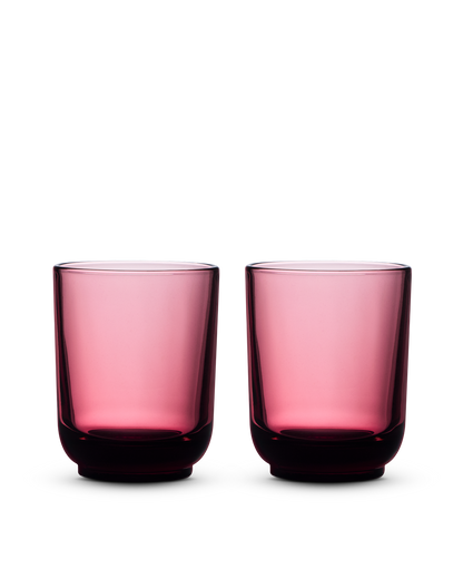 Two Fellow Pirch Espresso Glasses in pink displayed on a white background.