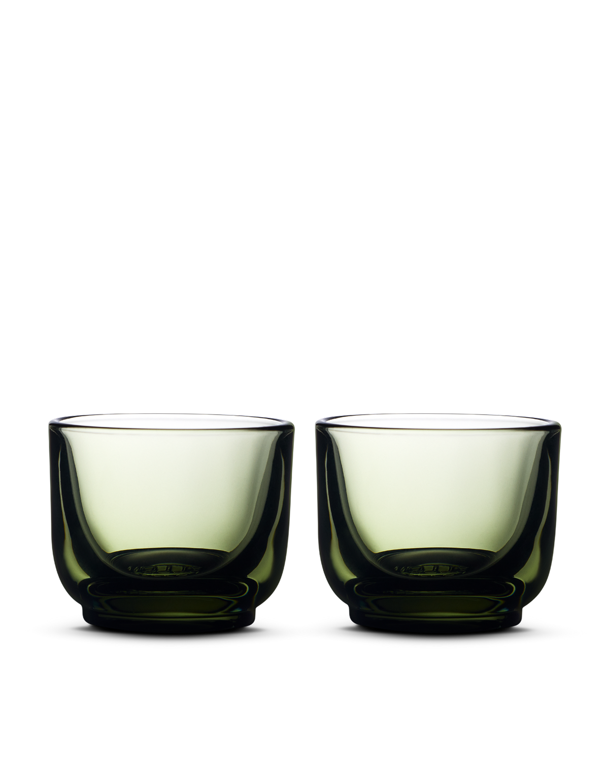 Two Pirch Espresso Glasses by Fellow, green, set side by side on a white background.
