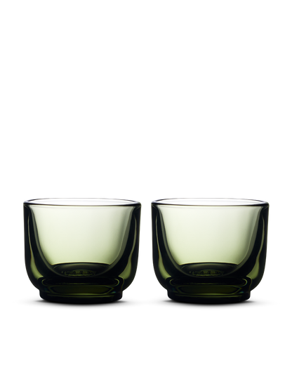 Two Pirch Espresso Glasses by Fellow, green, set side by side on a white background.