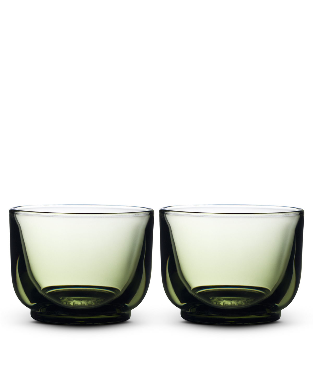 Two Pirch Espresso Glasses by Fellow with rounded bottoms sit side by side on white.