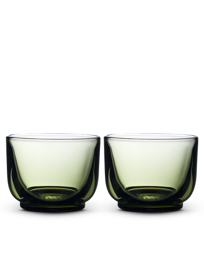Two Pirch Espresso Glasses by Fellow with rounded bottoms sit side by side on white.