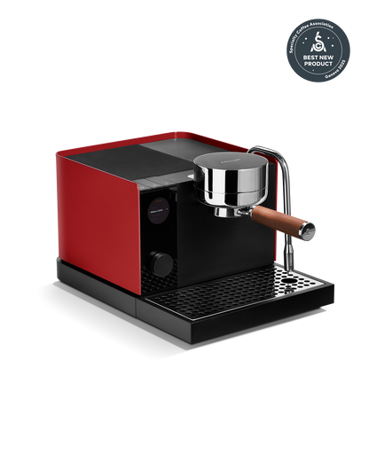 Beginner-friendly Fellow Espresso Series 1 in Cherry Red + Walnut with wood-handled portafilter.