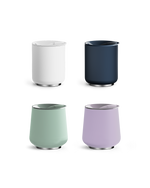 Four modern Fellow Stiff Drink Set tumblers in white, navy, mint green, and lavender.