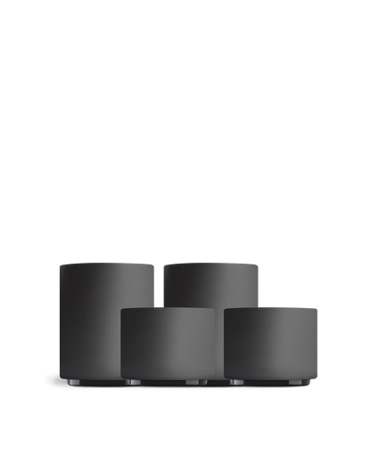 Four matte black Fellow Latte Art Set cups in different sizes on a white background.
